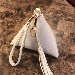 Cream wristlet.